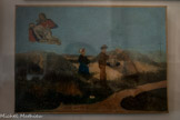 Chapelle Notre-Dame-de-Pitié <br> Famille priant Notre-Dame de Pitié lors du sauvetage de Marie Quatresols tombée dans un trou de sable ( ?). 1861. Toile. Marie Quatresols est née le 30 avril 1852 à Marignane. Fille de Léon Quatresols et de Marianne Turc, elle habite au n°4 de la rue des Vieux Fours dans le village. L'inscription, en partie effacée (Marie Quatresols âgée de 8 mois/1861) est erronée, la fillette ayant alors 8 ans. Au revers de la toile, apparaît un cachet tamponné, illisible. La Pietà peinte en haut à gauche est une copie du tableau du retable de la chapelle.