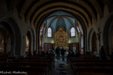 L’église Saint-Nicolas. <br> Sa nef, partie visible la plus ancienne, a été datée par M. Germain entre 1091 et 1094 grâce aux textes du cartulaire ; il s’agit d’une « reconstruction » dont on ignore encore si elle se trouve sur l’église antérieure, également connue par les textes du cartulaire. Les évolutions principales sont des XIIIe (chœur et chapelle nord-est, restaurée au XVIe siècle), XVIe (quatre chapelles) et XIXe siècles (autres chapelles et surélévation des chapelles sud du XVIe siècle).