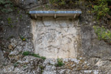 Bourg-Saint-Andéol. <br> Bas-relief du dieu Mithra. A l’époque romaine, ce bas-relief constituait le fond du temple du dieu Mithra sculpté à même le rocher, entre les deux sources, au cœur du Vallon de Tourne.
On voit le jeune dieu enfonçant le poignard dans le cou du taureau.
Par ce sacrifice, il assure le salut du monde menacé par les forces du mal représentées ici, par le serpent et le scorpion. De l’animal jaillit unie vie nouvelle, illustrée par l’épi de blé que l’on distingue à l’extrémité de la queue du taureau. Le soleil et la lune à l’extérieur de la scène donnent one dimension cosmique au sacrifice.
Aux IIe et IIIe siècles, le culte de Mithra, d’origine indo-iranienne, réservé aux hommes, est très répandu dans le monde romain.