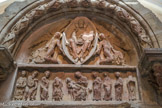Le tympan d’Anzy-Le-Duc <br>Le tympan adopte une composition simple centrée sur la figure du Christ en gloire ; la gloire est symbolisée matériellement par une mandorle, portée par deux anges. Le Christ en majesté est représenté assis bénissant de la main droite, et tenant l'Évangile dans la main gauche. L'originalité du linteau provient de la représentation de la Vierge allaitant le Christ. En Occident, cette représentation n'apparaît qu'à la fin du Moyen Age. Autour, certains apôtres et saintes femmes ont pris place, parmi lesquels saint Pierre, reconnaissable à la clé qu'il tient dans sa main gauche. Saint Etienne, représenté frontalement tenant le livre des Evangiles à l'extrême gauche du linteau, est identifiable grâce à son habit de diacre : la dalmatique et l'étole en bandoulière.
Plusieurs têtes sculptées sont postérieures, le Christ majesté, l’Enfant Jésus, une sainte femme.