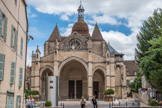 C’est vers 970 que Henri le Vénérable, duc de Bourgogne, décide de fonder une église plus grande que l’ancienne église Saint-Baudèle, avec un chapitre de chanoines. Une première église fut alors construite vers l’an 1000 avec les matériaux provenant du castrum antique.
C’est au 12e siècle que les ducs commencèrent le chantier d’une nouvelle collégiale, marquant la prospérité de Beaune à cette époque. La construction fut commencée, probablement vers 1130, par le duc Hugues II le Pacifique (1084-1143) et par son épouse Mathilde de Turenne. L’église assume le style clunisien des grandes églises construites sous l’épiscopat autunois d’Etienne de Bâgé (1112-1139), Saint-Lazare d’Autun et Saint-Andoche de Saulieu. Elle est mentionnée dans des bulles papales de Calixte II en 1120 et d’Eugène III en 1148, qui place l’église sous sa protection. En 1162, Mathilde de Turenne est enterrée sous le maître-autel. L’église est agrandie pendant la deuxième moitié du 12e siècle par le duc Hugues III (1148-1192). Deux travées de nef furent ajoutées pour recevoir les foules de pèlerins visitant l’église et c’est seulement au début du 13e siècle que la grande église romane fut terminée.