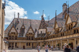 Nicolas Rolin avait hérité d’un patrimoine non négligeable, mais c’est sa carrière à la cour ducale et surtout sa nomination, le 3 décembre 1422, au poste de chancelier qui lui a permis d'asseoir et de développer sa fortune. Cette nouvelle fonction lui rapportait à peu près 5 000 francs par an (cinq fois le revenu d’un receveur général et 100 fois celui d’un maçon de l'époque). A cela il faut ajouter les dons du duc et les cadeaux d’autres personnages importants pour faire avancer leurs intérêts.
Ces revenus ne firent qu'augmenter au fil des années et lui permirent de financer de somptueuses fondations que le duc soutenait par des exemptions et de nombreux privilèges.
Après que le duc le fit chevalier en 1424, Nicolas Rolin, tout au long de sa vie, n'eut de cesse de montrer sa noblesse à tous égards.
Il s'inscrivait ainsi dans la tradition médiévale montrant sa piété et imitant son seigneur et duc Philippe le Bon.