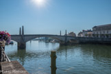 Le pont Saint-Laurent qui a été partiellement détruit dans la nuit du 5 septembre 1944. Il a été entièrement détruit pour le reconstruire légèrement déplacé. Cette reconstruction a permis d'étudier le pont ancien dont les éléments archéologiques avaient été déposés entre 1946 et 1952 au musée municipal. Le conservateur du musée, L. Armand-Calliat, avait supposé que le pont médiéval avait été construit à l'emplacement d'un pont romain fait de piles en pierre et de tablier en bois.