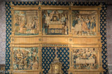 Dans la Chapelle Notre-Dame-de-Pitié, dans le croisillon sud, la grande tapisserie eucharistique date de 1510. Cette tapisserie, de facture flamande, était destinée à orner la façade de la maison des donateurs, la famille Baichet, qui habitait l’actuelle maison des 4 saisons rue du Châtelet. La devise de la famille, Spes mea Deus, est répétée dans les médaillons.
Les jours de procession du Saint-Sacrement, elle servait de toile de fond au reposoir comme montré sur le motif central.
Elle représente le mystère de l'Eucharistie : son institution décrite dans les Evangiles et sa préfiguration dans trois scènes bibliques. Le panneau central supérieur montre la famille Baichet en adoration devant le Saint Sacrement, l’ostensoir, sous un dais, est présenté par deux anges. A l’époque de la création de cette œuvre, c’était une innovation à double titre : la vénération des Saintes Espèces commençait à se répandre ; la famille Baichet n’est pas représentée accompagnée de ses saints patrons. 
En haut à gauche : Melchisédech (nom qui veut dire 