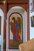 <center>St Hermogène</center>Saint Gabriel. Comme c'est de tradition dans l'art de l'icône, Roublev, dans l'icône suivante, utilise la perspective inversée pour que le monde représenté dans la peinture ne se présente pas comme une fenêtre par laquelle l'esprit humain pénètre dans le monde représenté, mais que ce monde représenté rayonne au contraire vers le spectateur. Cet effet est produit par le fait que les lignes de fuite de la composition ne se rencontrent pas dans un point de fuite situé derrière le tableau, mais en un point situé devant le tableau. Les éléments caractéristiques de ce type de perspective sont appliqués dans l'icône de la Trinité de la manière suivante : 
    l'espace est peu profond, limité au premier plan, fermé vers le fond par le rocher, l'arbre et la maison. Il n'y a pas d'illusion de trois dimensions. L'ange qui se situe au centre n'est pas de taille différente des deux autres alors qu'il est plus éloigné. Il est agrandi pour appartenir au premier plan ;
    les éléments d'architecture et les objets sont peints en axonométrie. Les scènes se jouent à l'extérieur pour éviter de devoir représenter la profondeur de l'espace intérieur ;
    la ligne de force va de l'intérieur de l'icône vers l'extérieur, vers le spectateur. À cette fin, les pose-pieds situés aux pieds des deux anges à l'extérieur de la composition sont représentés de taille plus réduite à l'avant, au lieu de l'être plus largement à l'avant qu'à l'arrière. De même pour le plafond de la maison située à l'arrière-plan. Le bord en surplomb à l'avant est plus petit que l'arrière de ce plafond, alors que l'éloignement devrait provoquer un calcul de mesure inverse ;
    les côtés des sièges des deux anges situés à l'avant sont orientés pour refermer le cadre vers le spectateur.