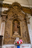 <center>Eglise Saint Théodore</center>St François d’Assise, fondateur de l’ordre, statue de 1820 en bois recouvert d’un tissu empesé. A gauche, il est représenté en prière et à droite, recevant les stigmates. En haut, les deux bras croisés.
