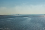 <center>Saint-Nazaire. </center> Le port, vue du pont. Au loin, raffinerie de Donges.