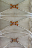 <center>La Cathédrale Saint-Pierre Saint-Paul. </center> Sous la terreur, toutes les décorations des clés de voûte (qui représentaient souvent les armes des bailleurs de fonds pour les travaux de la cathédrale) furent détruites, et il ne subsista donc que des trous béants jusqu'à la fin du XXè siècle.
Détail remarquable : quatre de ces clés furent refaites non en pierre mais en bois de tilleul, sculptées et peintes par Maurice Mainguy et posées en 1986. Il s'agit des quatre premières clés à partir de l'oculus du choeur, en allant vers les portails. On repère aisément les armes du roi de France, Louis XIII donc, qui permit l'élévation de la voûte, puis celles de Bretagne, puis deux clés pendantes, et les suivantes sont en pierre.