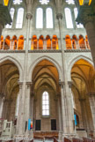 <center>Basilique St Nicolas. </center>  Dans la partie haute, on aperçoit le triforium et les galeries qui parcourent le vaisseau, les bras du transept et le chœur.