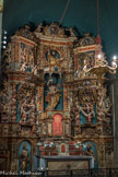 L’église Notre-Dame-des-Anges. <br>  Retable de la chapelle du Saint-Sacrement construit peu avant 1700, peut-être par Joseph Sunyer.
Le tout est en bois sculpté où sont représentées les diverses scènes de l’Eucharistie. La statue du Christ tenant un calice où tombe un jet de sang qui gicle de sa poitrine, mérite d'être remarquée. Dans la partie supérieure Trône de Dieu le Père surmonté du Saint Esprit représenté per une colombe. L'ensemble forme le groupe de la Sainte-Trinité.